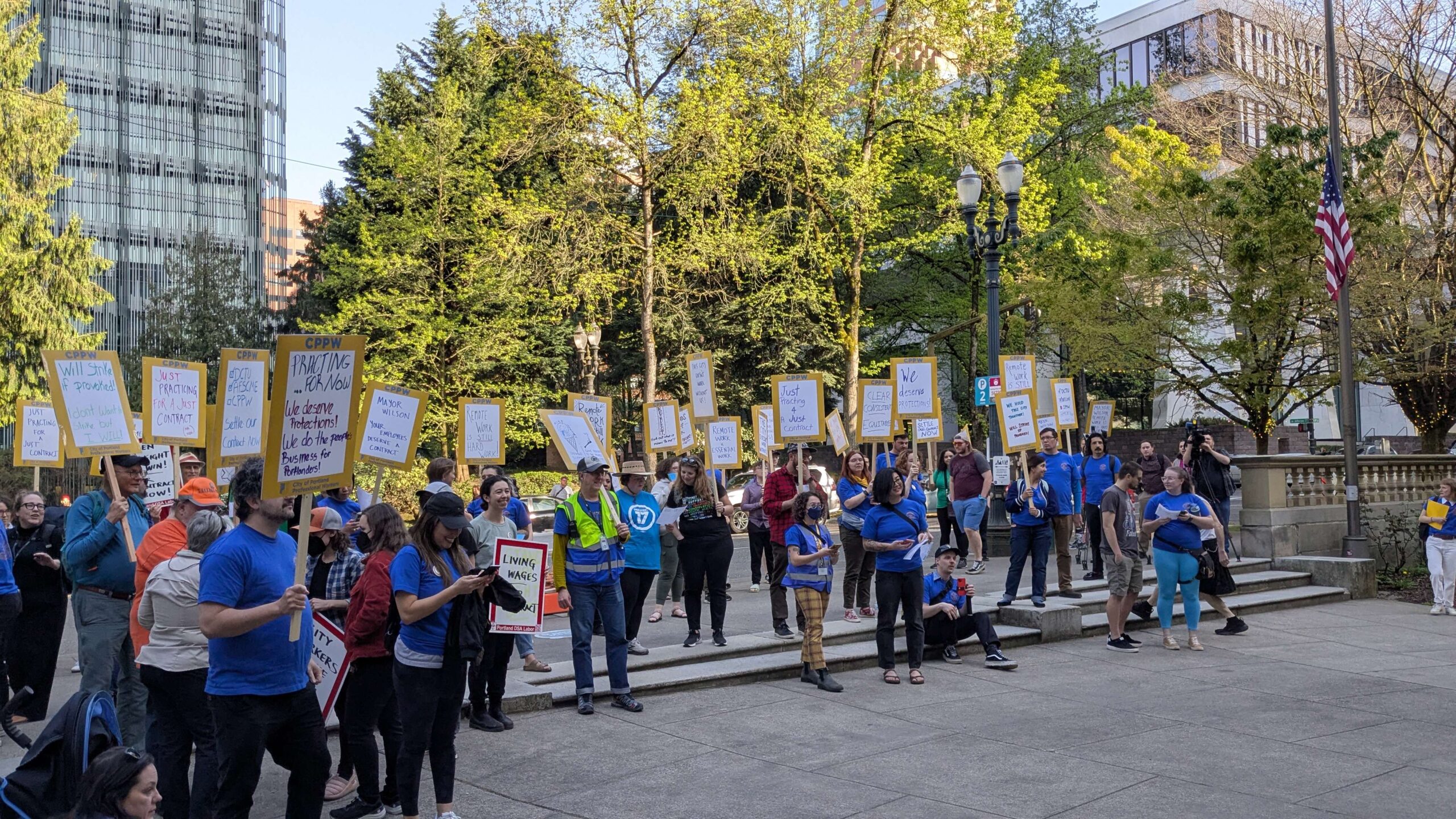 Group photo of CPPW members at the 4/23 Practice Picket event, outside City Hall.